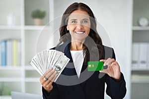 Lady manager hold lot of dollars cash and credit card