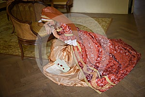 Lady in medieval dress on floor