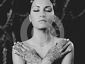 Lady with painted hands mehendi