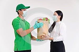 Lady recieving food  ingredients from grocery driver