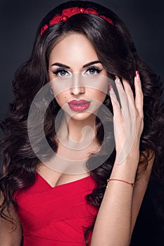 Lady in red. Beautiful woman portrait in red dress, with red lips and accessories.