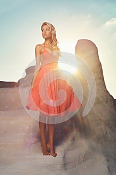 Lady in red dress in an unusual landscape photo