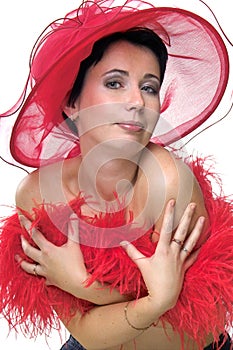 Lady in red hat embrassing herself