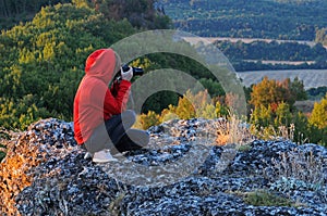 Lady in red hoodie take photos