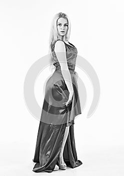Lady rented fashionable dress for visiting event. Dress rent service, fashion industry. Girl blonde posing in dress