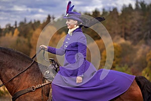 Lady in riding habbit photo