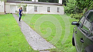 Lady run toward car rain