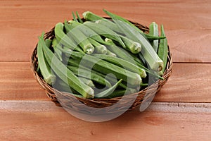 Lady\'s finger or Okra with wooden background