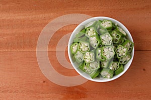 Lady\'s finger or Okra with wooden background