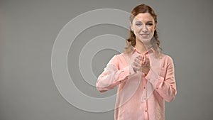 Lady saying believe in sign language, showing words in asl lesson, communication