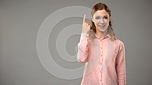 Lady saying i understand in sign language, teacher showing words in asl lesson photo
