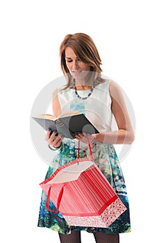 A lady at shoppings reading a book photo