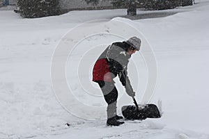 Lady Shoveling Snow