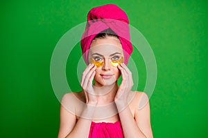 Lady in shower use under eyes patches wear pink towels on body head isolated bright green color background