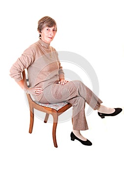 Lady sitting on chair.