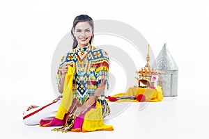 The lady in Southern thai classical dancing suit is sitting on white background