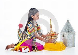 The lady in Southern thai classical dancing suit is touching the headdress ,prepare for put on her head