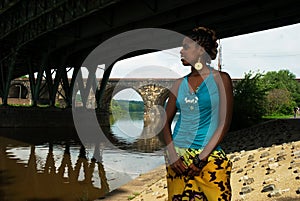 Lady stands under the bridge