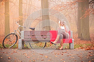 Lady with tablet in park.