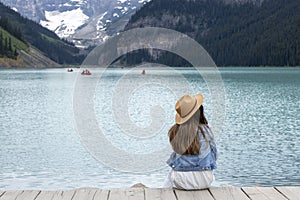 A lady tourist enjoys the beauty of Lake Louise