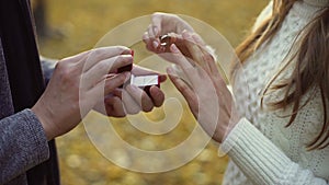 Lady trying on engagement ring gifted by boyfriend, precious gift, betrothal