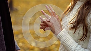 Lady trying on engagement ring gifted by boyfriend, precious gift, betrothal