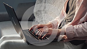 Lady typing laptop cropped shot