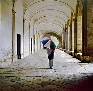 Lady with umbrella walking in the galleries