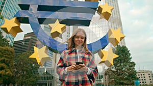 Lady uses Mobile App on Smartphone Walking by Euro sign in Business district