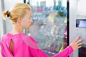 Lady using a modern vending machine