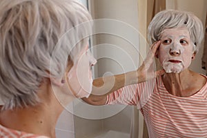 Lady using a nourishing tissue face mask