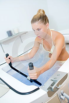 Lady in water on exercise machine