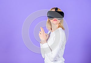 Lady with weapon gesture. Enthralling interaction virtual reality. Woman head mounted display violet background. Virtual