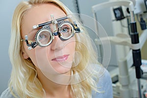 Lady wearing opticians testing glasses