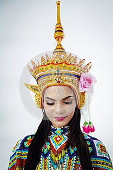 The lady is wearing Southern Thai Classical Dancing suit and the Headdress on her head