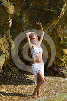 lady in wet lace dress in a grot