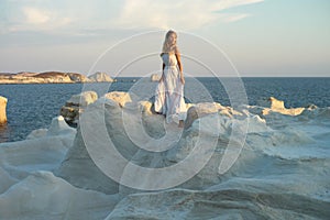 Lady in white dress in an unusual landscape