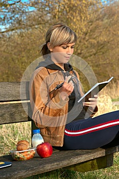 Lady Writing Outdoors