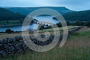 Ladybower Reservoir, Peak District UK: A close up of a hillside next to a body of water