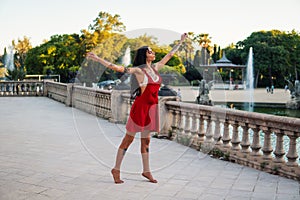 Ladyboy tattooed transgender model is dancing in the green park