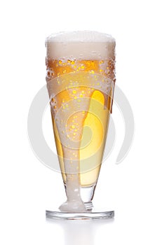 Lager beer in a glass beaker with fresh bubbling foam. alcoholic