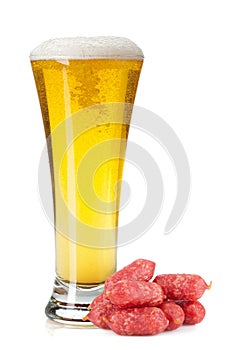 Lager beer glass and mini sausages