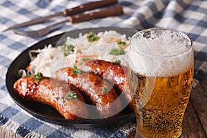 Lager beer and snacks of sausages and sauerkraut