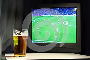 Lager and football on the tv photo