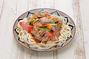 Laghman, hand pulled noodles dish with lamb meat and vegetables