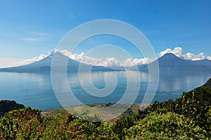 Lago Atitlan along with 2 volcanoes, Panajachel, Guatemala photo