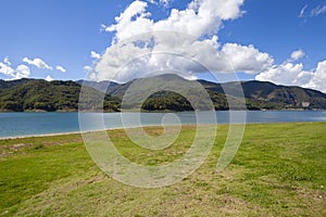 Lago Del Salto, in Lazio region (Italy), reflects the sky and greenery