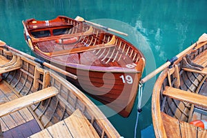 Lago di Braers lake, Dolomite Alps, Italy. Boats on the lake. Landscape in the Dolomite Alps, Italy.