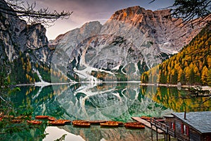 Lago di Braies lake and Seekofel peak at sunrise, Dolomites. Italy photo