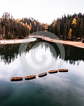 Lago di Braies Pragser Wildsee Drone autumn fall Italy Boats and reflection photo